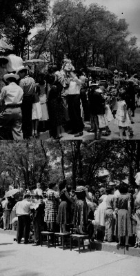 Personas presenciando un desfile en un parque