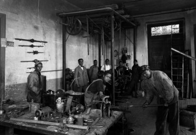 Trabajadores de una herrería, retrato